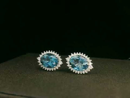 18k white gold London Blue Topaz and diamond halo earrings