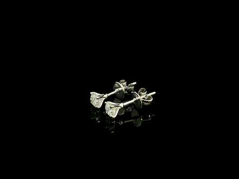 Diamond solitaire stud earrings in 18K white gold featuring round brilliant diamonds in classic four-prong settings.