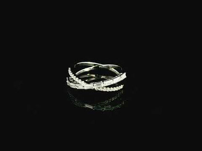 Baguette and round diamond crossover ring in 18K white gold criss-cross design Emirates Diamonds