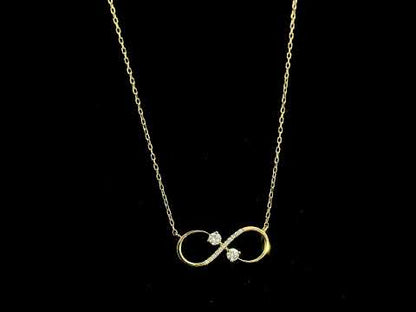 18K yellow gold infinity diamond necklace with round natural diamonds and pavé-set infinity pendant, handcrafted fine jewellery by Emirates Diamonds.