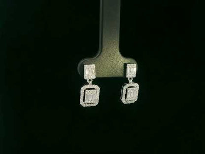 18K white gold diamond drop earrings with baguette-cut center and halo setting – Emirates Diamonds