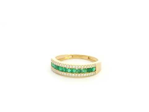 Emerald and diamond band ring in 18K yellow gold with channel set design by Emirates Diamonds