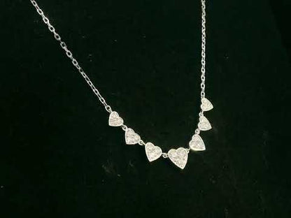 Diamond heart cascade necklace in 18K white gold – pavé hearts, 0.47 carat diamonds, Emirates Diamonds.