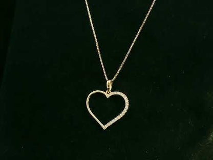 18K yellow gold open heart pendant with 0.15 carat natural diamonds by Emirates Diamonds