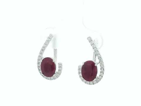 Front view of 18k white gold earrings with oval rubies totaling 2.96 carats and 0.38 carat pave diamonds, latch-back closure