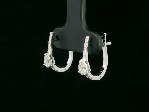 A pair of 18K gold hoop earrings featuring pear-shaped diamonds (0.41ct total) and accent diamonds (0.09ct total), elegantly designed for a timeless look.