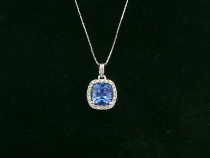 18K white gold Tanzanite and diamond halo pendant with cushion-cut 2.02 carat center stone
