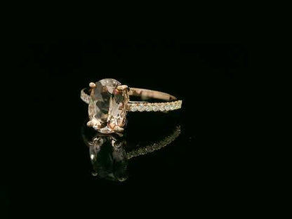 18K rose gold ring with 2.13 carat oval morganite and 0.21 carat diamond accents, elegant contemporary design