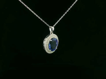 Oval Tanzanite pendant with two diamond halos