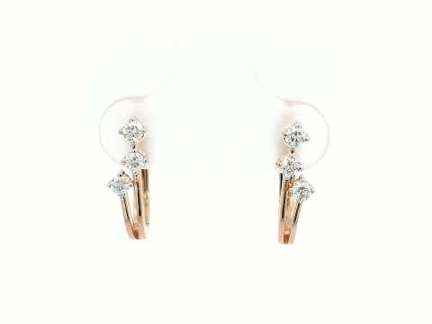 18K gold huggie hoop earrings with 0.24 carats of diamonds in a sleek multi-diamond design.