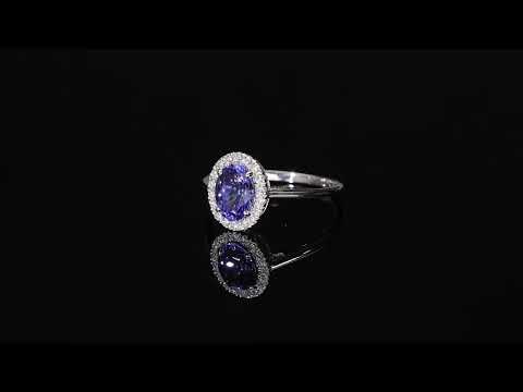 Tanzanite and diamond ring in 18K white gold with oval tanzanite and round diamond halo