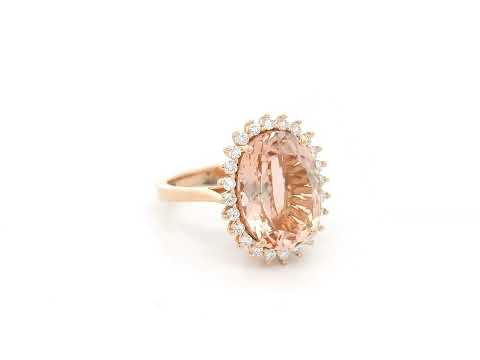 18K rose gold morganite and diamond halo ring featuring an oval morganite and sparkling diamond accents by Emirates Diamonds.