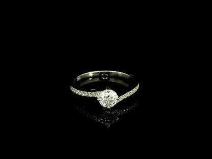 GIA certified round diamond engagement ring in 18K white gold with curved diamond band