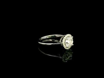 18K white gold round diamond halo engagement ring with a 0.98 carat IGI certified centre diamond and sparkling diamond halo.