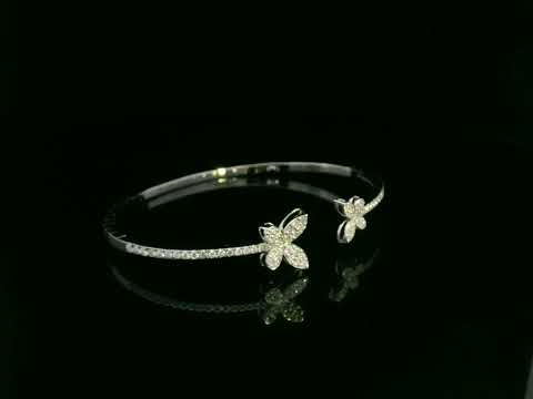 0.85 carat diamond butterfly bangle in 18K white gold by Emirates Diamonds with pavé diamond band.
