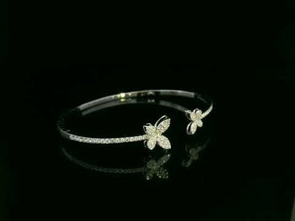 0.85 carat diamond butterfly bangle in 18K white gold by Emirates Diamonds with pavé diamond band.