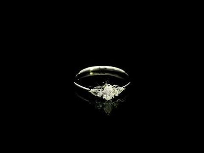 Pear shaped three stone diamond engagement ring in 18K white gold
