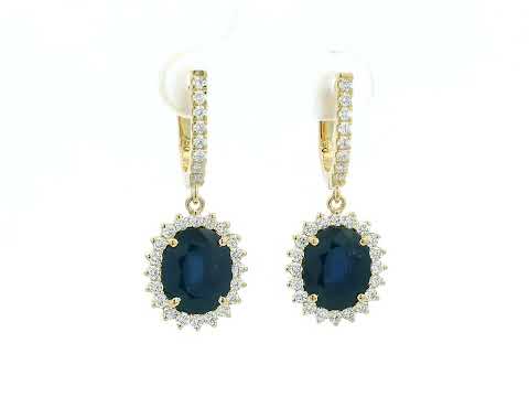 18K yellow gold earrings with 6.41ct oval blue sapphires and 0.91ct diamond sunburst halo design
