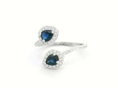 Pear-shaped sapphire and diamond bypass ring in 18K white gold with double halo design

