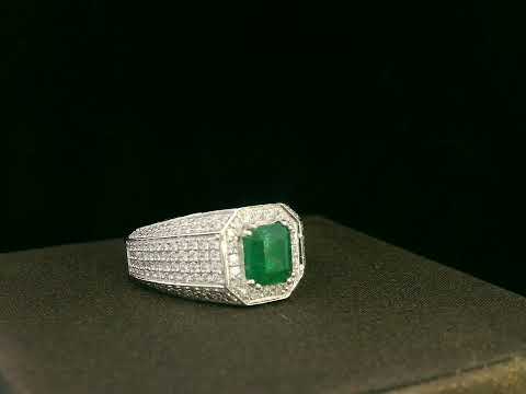 18K white gold men’s ring with emerald-cut emerald and diamond halo.