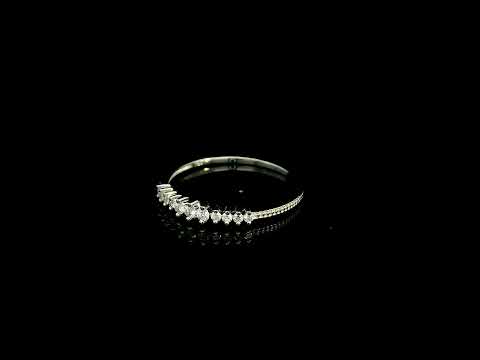 Graduated diamond band ring in 18K white gold with round brilliant diamonds tapering towards each side.