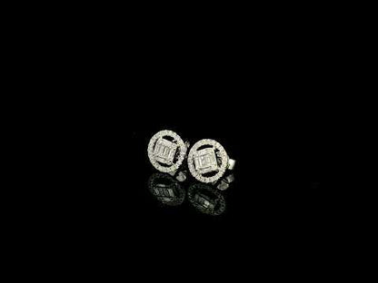 18K white gold emerald cut illusion diamond stud earrings featuring round and baguette natural diamonds with a sparkling round diamond halo and secure butterfly backs.