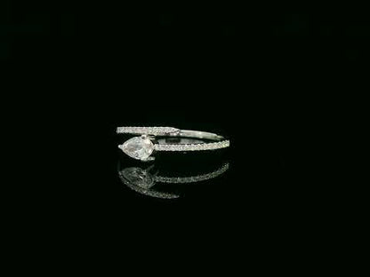 18K white gold diamond bypass ring with pear-cut diamond on one end and pavé diamond sweep, total diamond weight 0.43 carat – Emirates Diamonds
