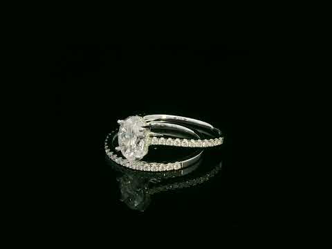 18K white gold oval diamond bridal ring set with IGI certified diamond and matching wedding band by Emirates Diamonds.