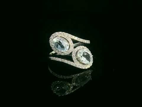 Video of 18k white gold ring with two oval aquamarines and 0.39 ct diamond halos