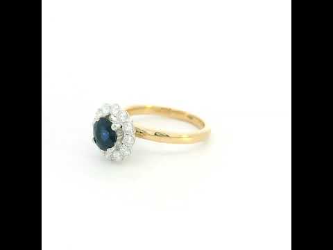 Round blue sapphire and diamond ring in 18K yellow gold with 0.84 carat natural sapphire and diamond surround