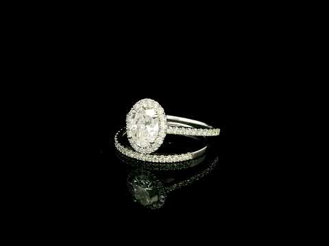 Oval diamond bridal set in 18K white gold with GIA certified natural diamond halo engagement ring and matching diamond wedding band