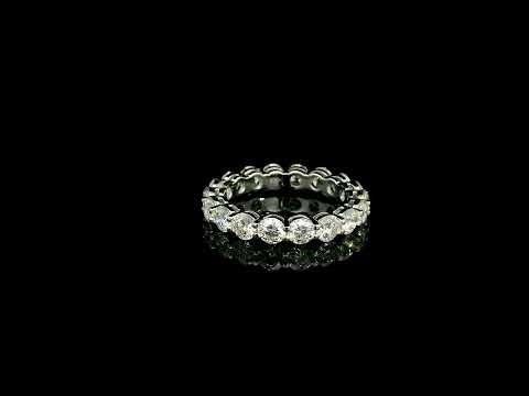 Full diamond eternity ring with round brilliant diamonds set around the entire band in 18K white gold.
