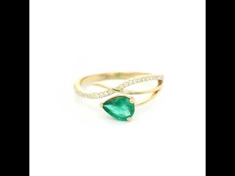 18K yellow gold emerald crossover ring featuring a 0.51 carat natural emerald and 0.09 carat natural diamond accent band.