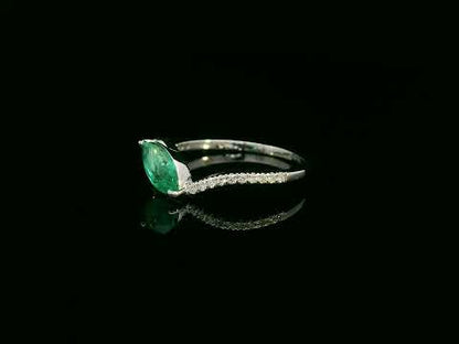 18K white gold emerald and diamond crossover ring with marquise-cut 0.65 carat emerald