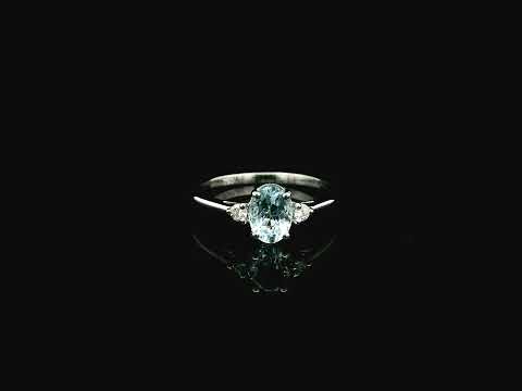 Oval aquamarine and diamond three stone ring in 18K white gold