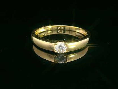 Tapered 18K yellow gold solitaire ring with a 0.30 carat round diamond in a sleek four-prong setting.