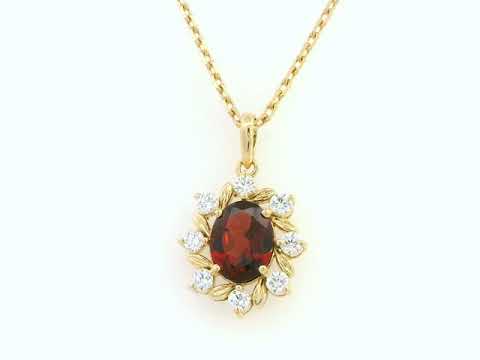 Oval-cut garnet and diamond necklace in 18K yellow gold by Emirates Diamonds