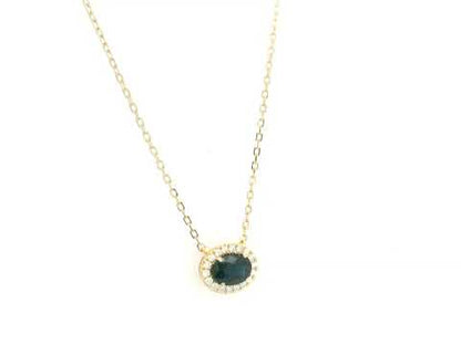 18K yellow gold sapphire and diamond halo pendant necklace with oval blue sapphire center stone