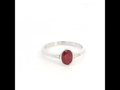 Oval ruby and diamond ring in 18K white gold