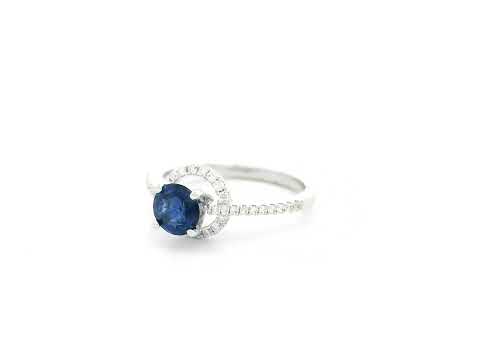0.67 carat blue sapphire and diamond halo ring in 18K white gold by Emirates Diamonds