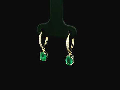 Emerald drop hoop earrings in 18K yellow gold with 0.95 carat emeralds and 0.09 carat diamond pavé hoops by Emirates Diamonds.