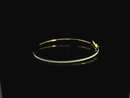 18K yellow gold diamond bangle featuring 0.54 carat natural diamonds in an elegant open bangle bracelet design.