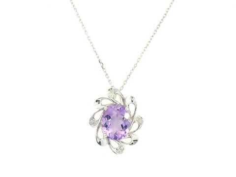 Purple amethyst pendant in gold with delicate diamond detail