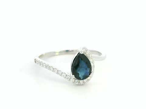 Video of 18k white gold ring with 0.90 ct pear-shaped blue sapphire and 0.14 ct diamonds in bypass design