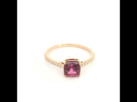 18K rose gold ring with a cushion-cut raspberry-pink rhodolite garnet and pavé diamond shoulders.