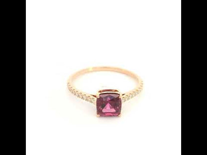 18K rose gold ring with a cushion-cut raspberry-pink rhodolite garnet and pavé diamond shoulders.