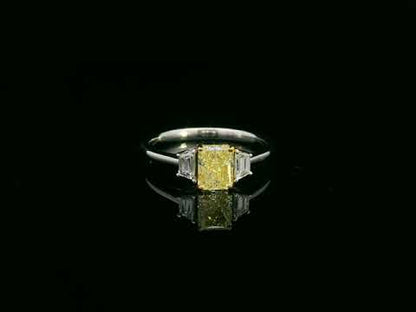 18K white gold fancy yellow radiant-cut diamond ring with tapered white diamond side stones – Emirates Diamonds.