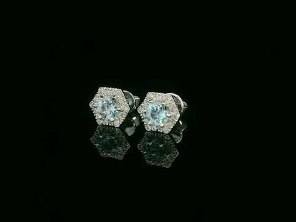 Video of 18k gold stud earrings with round aquamarines and diamond halo