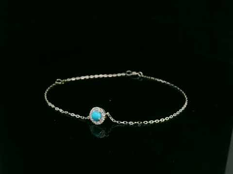 18K white gold turquoise and diamond halo bracelet featuring a 0.28 carat turquoise and 0.11 carat diamonds by Emirates Diamonds
