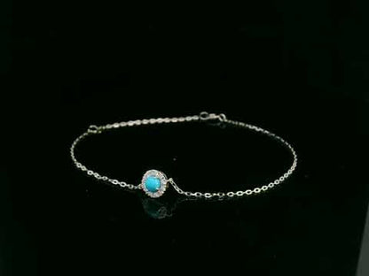 18K white gold turquoise and diamond halo bracelet featuring a 0.28 carat turquoise and 0.11 carat diamonds by Emirates Diamonds